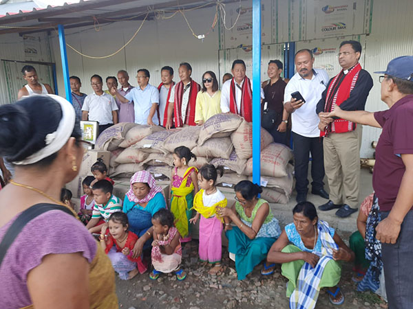 Members of the visiting team with some of their relief goods with those from Manipur